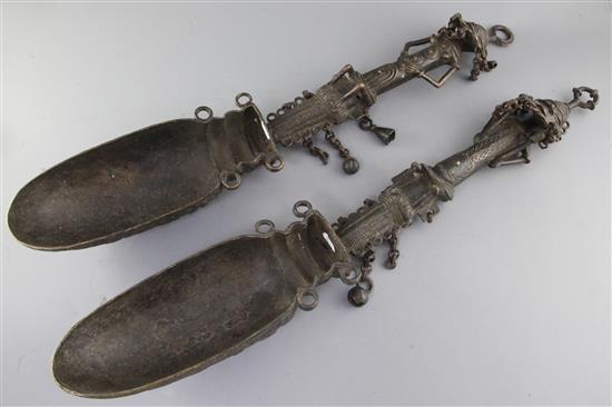 A pair of Yoruba of Ogboni Secret Society bronze ladles, with figural handles, 65cm